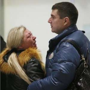 Relatives react after a Russian airliner with 217 passengers and seven crew aboard crashed, as people gather at Russian airline Kogalymavias information desk at Pulkovo airport in St.Petersburg, Russia, Saturday, Oct. 31, 2015. Russia's civil air agency is expected to have a news conference shortly to talk about the Russian Metrojet passenger plane that Egyptian authorities say has crashed in Egypt's Sinai peninsula.(AP Photo/Dmitry Lovetsky)
